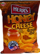 Herr's Honey Cheese flavored Chips balances a salty cheddar base with a smooth, floral honey finish. 